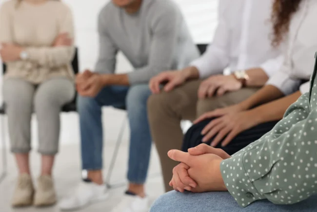 people-group-therapy-session-indoors-closeup